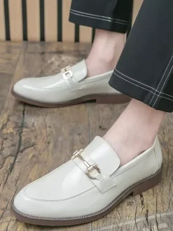 Mocassins à mors pour homme à enfiler bout pointu talons bas décoration métallique