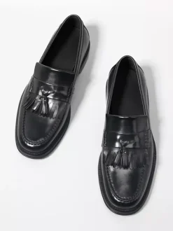Mocassins noirs à bout rond pour hommes à enfiler avec pompons