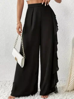 Pantalon noir uni à volants et taille naturelle idéal pour l'été
