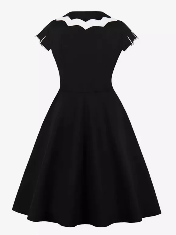 Robe cocktail vintage sans manches style swing années 1950