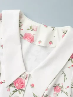 Robe courte à imprimé floral manches bouffantes col Claudine et lacets dans le dos été 2026