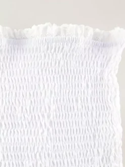 Robe courte en dentelle ajourée pour femme - Robe bustier blanche à volants et smocks - Idéale pour les vacances d'été à la plage 2026