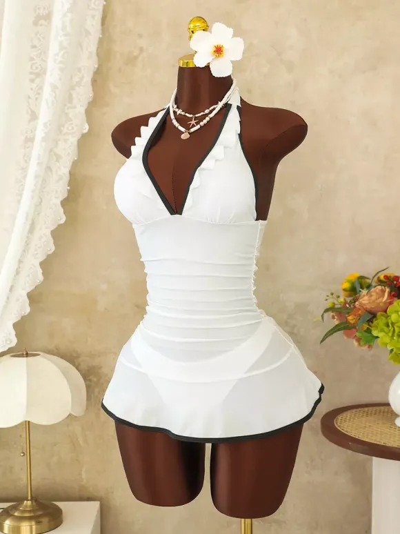 Robe de bain une pièce à volants dos nu et jupe froncée ornée de passepoils contrastants