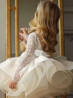 Robe de demoiselle d'honneur fille tulle perlé col bijou manches longues champagne