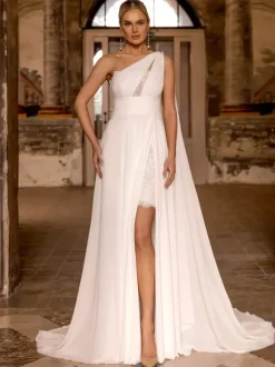 Robe de mariée bohème en mousseline de soie et dentelle deux pièces avec traîne taille naturelle fermeture éclair sans manches décolleté design ivoire