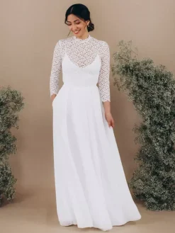 Robe de mariée deux pièces en dentelle col rond coupe trapèze dos nu manches longues ivoire