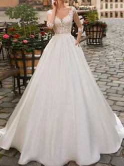 Robe de mariée ivoire col V demi manche en dentelle jupe en satin boutonné sur dos Robe de mariage