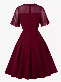Robe de soirée élégante à manches transparentes et col rond ornée de patchwork en maille collection 2026