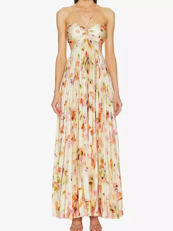 Robe de soirée longue à bretelles spaghetti et dos nu imprimé floral style bohème idéale pour l'été et la plage.