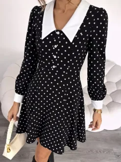 Robe de soirée mini fluide à pois col contrastant et manches longues coupe trapèze à pois.
