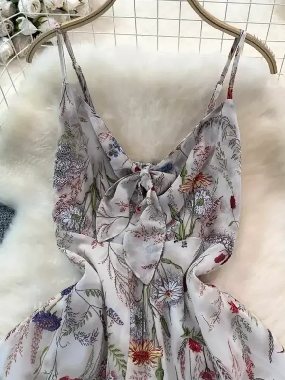 Robe de vacances maxi dos nu à fleurs bretelles fines sans manches imprimé floral col chic couleur abricot