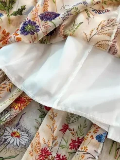Robe de vacances maxi dos nu à fleurs bretelles fines sans manches imprimé floral col chic couleur abricot