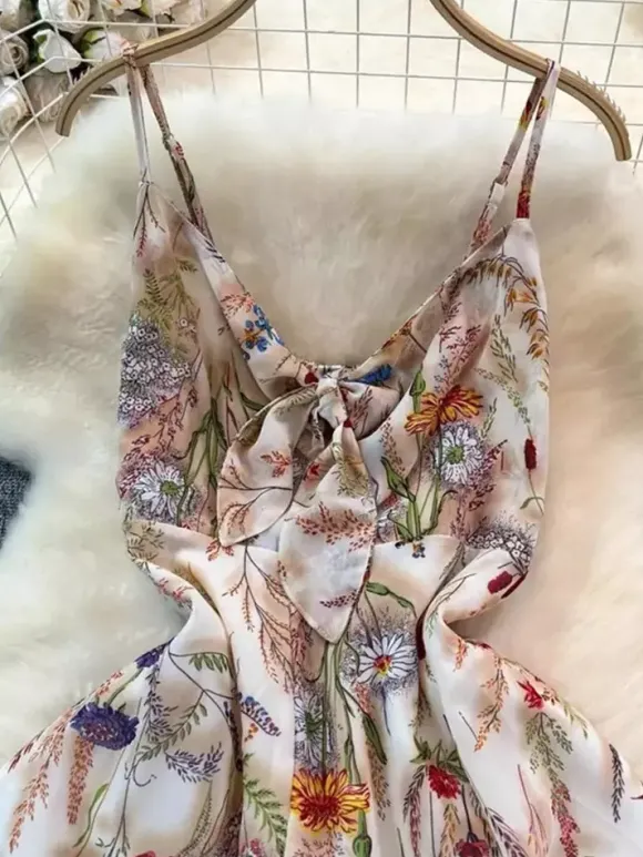 Robe de vacances maxi dos nu à fleurs bretelles fines sans manches imprimé floral col chic couleur abricot