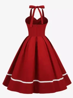 Robe glamour rétro style années 50 bordeaux à boutons superposés sans manches décolleté c艙ur coupe trapèze