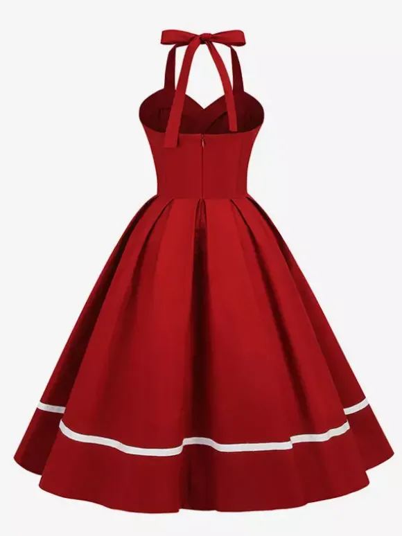 Robe glamour rétro style années 50 bordeaux à boutons superposés sans manches décolleté c艙ur coupe trapèze