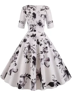Robe glamour vintage noire style années 50 imprimé floral manches mi-longues superposées décolleté c艙ur taille M style rockabilly
