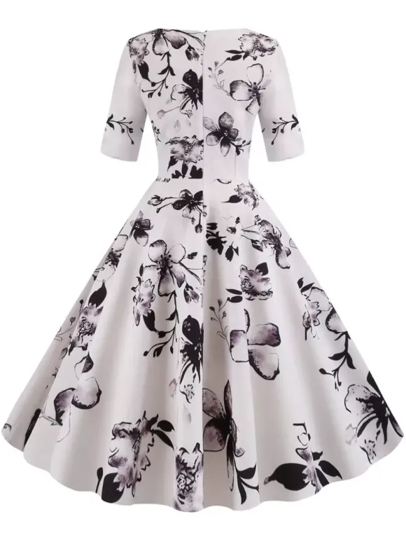 Robe glamour vintage noire style années 50 imprimé floral manches mi-longues superposées décolleté c艙ur taille M style rockabilly