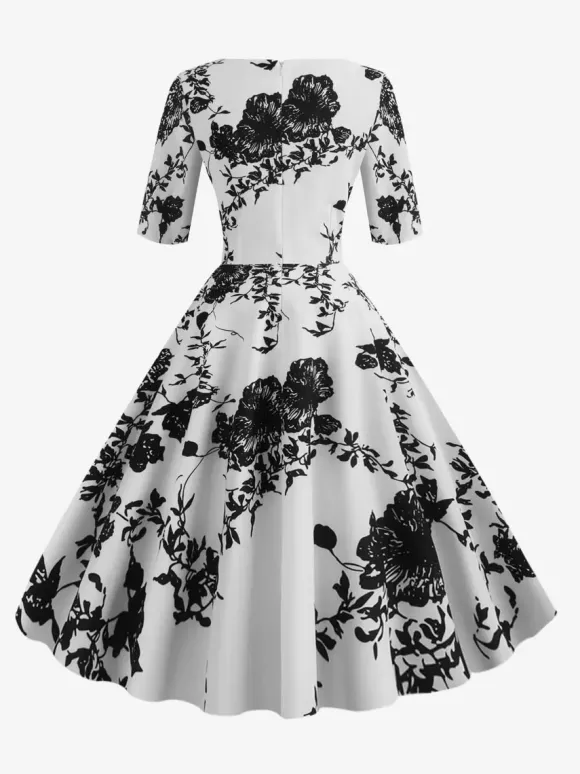 Robe glamour vintage noire style années 50 imprimé floral manches mi-longues superposées décolleté c艙ur taille M style rockabilly
