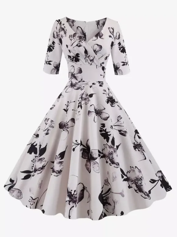 Robe glamour vintage noire style années 50 imprimé floral manches mi-longues superposées décolleté c艙ur taille M style rockabilly
