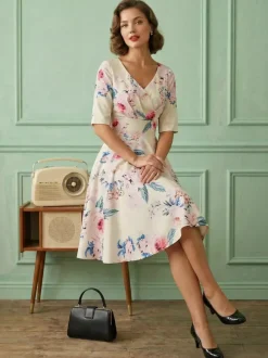 Robe glamour vintage noire style années 50 imprimé floral manches mi-longues superposées décolleté c艙ur taille M style rockabilly