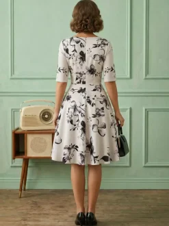 Robe glamour vintage noire style années 50 imprimé floral manches mi-longues superposées décolleté c艙ur taille M style rockabilly