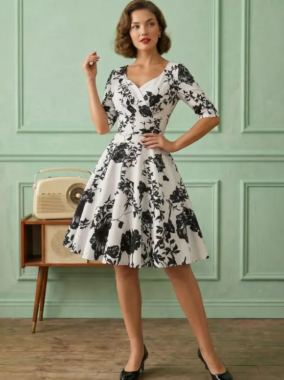 Robe glamour vintage noire style années 50 imprimé floral manches mi-longues superposées décolleté c艙ur taille M style rockabilly