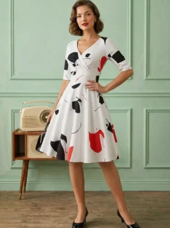 Robe glamour vintage noire style années 50 imprimé floral manches mi-longues superposées décolleté c艙ur taille M style rockabilly