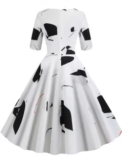 Robe glamour vintage noire style années 50 imprimé floral manches mi-longues superposées décolleté c艙ur taille M style rockabilly