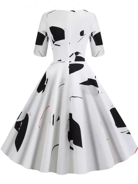 Robe glamour vintage noire style années 50 imprimé floral manches mi-longues superposées décolleté c艙ur taille M style rockabilly