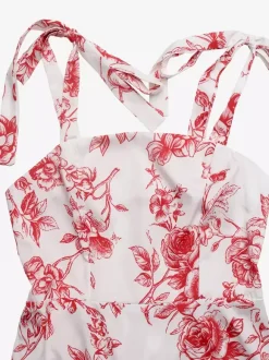 Robe longue d'été fluide à imprimé floral blanc et rouge pour femme col carré bretelles à nouer idéale pour la plage.