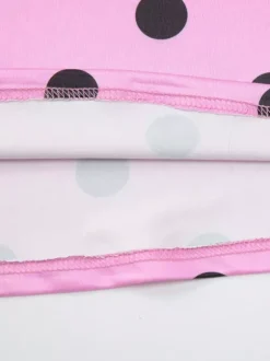 Robe longue rose à pois pour femme dos nu lacée sans manches bretelles et col montant.