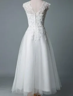 Robe mariée courte col rond en dentelle pailletes jupe en tulle zip sur dos Robe de mariage