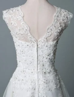 Robe mariée courte col rond en dentelle pailletes jupe en tulle zip sur dos Robe de mariage
