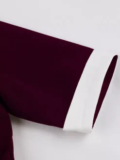 Robe midi élégante à revers rétro et boutons latéraux coupe ajustée et évasée pour femme (collection 2026)