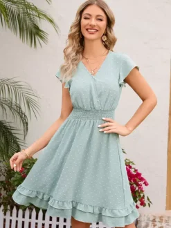 Robe mi-longue rose pâle à col en V et ourlet à volants avec taille froncée 2026