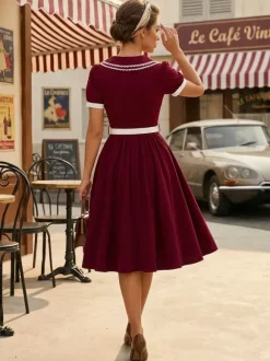 Robe trapèze à manches bouffantes col Peter Pan et broderies double épaisseur collection femme 2026