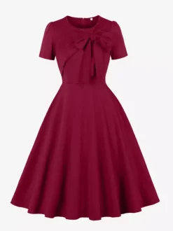 Robe trapèze à manches courtes et col rond ornée d'un n艙ud sur le côté collection femme 2026