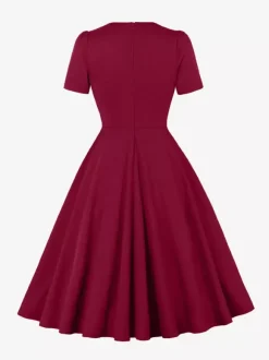 Robe trapèze à manches courtes et col rond ornée d'un n艙ud sur le côté collection femme 2026