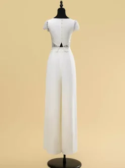 Robe de mariée deux pièces en dentelle découpée avec col bijou deux pièces longueur au sol fermeture éclair manches courtes longueur au sol ivoire