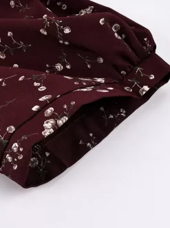 Robe de soirée maxi bordeaux à manches courtes bouffantes et col montant