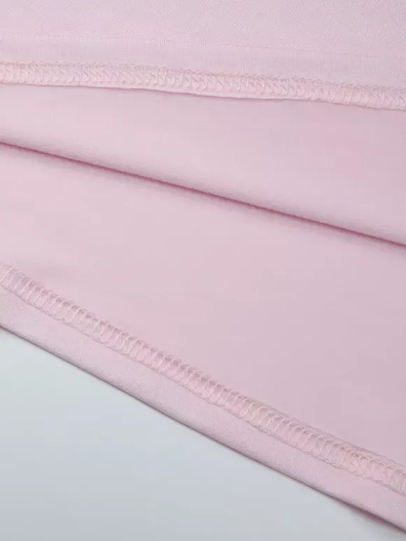 Robe de soirée moulante rose poudré à décolleté plongeant et dos nu froncé