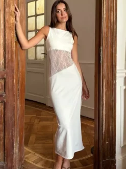 Robe de soirée noire et blanche moulante midi sans manches taille en dentelle découpée sans manches.