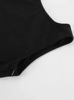 Robe de soirée noire et blanche moulante midi sans manches taille en dentelle découpée sans manches.