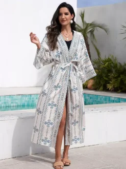 Robe de vacances imprimée bleu ciel clair à manches longues et ceinture à volants