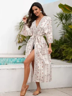 Robe de vacances imprimée bleu ciel clair à manches longues et ceinture à volants
