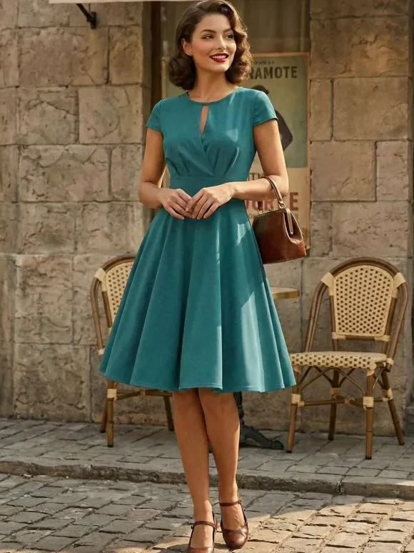 Robe glamour vintage style années 50 col rond manches courtes découpées coupe trapèze moyenne