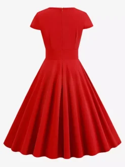 Robe glamour vintage style années 50 col rond manches courtes découpées coupe trapèze moyenne