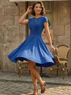 Robe glamour vintage style années 50 col rond manches courtes découpées coupe trapèze moyenne