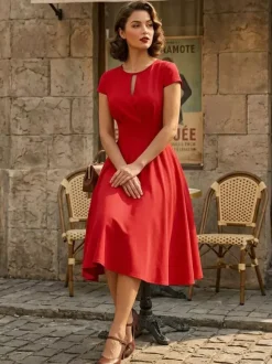 Robe glamour vintage style années 50 col rond manches courtes découpées coupe trapèze moyenne