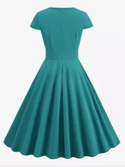 Robe glamour vintage style années 50 col rond manches courtes découpées coupe trapèze moyenne